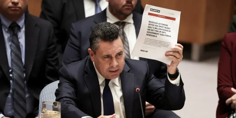 Venezuela Ambassador to the United Nations Samuel Reinaldo Moncada Acosta speaks as he holds up a news article, during a UN Security Council meeting on U.S. strikes and the capture of Venezuelan President Nicolas Maduro and his wife, Cilia Flores, at the United Nations headquarters in New York, U.S., January 5, 2026. REUTERS/Brendan McDermid