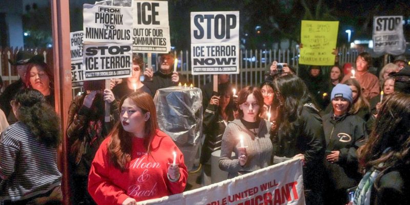 People gather outside the Phoenix ICE Field Office on Jan. 7, 2026, for a vigil in honor of Renee Nicole Good, who was shot and killed by an ICE agent in Minneapolis.