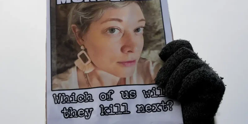 A demonstrator holds a picture of Renee Nicole Good as people protest against the fatal shooting of Good by a U.S. Immigration and Customs Enforcement (ICE) agent, during a rally against increased immigration enforcement across the city outside the Whipple Building in Minneapolis, Minnesota, U.S., January 8, 2026. REUTERS/Tim Evans