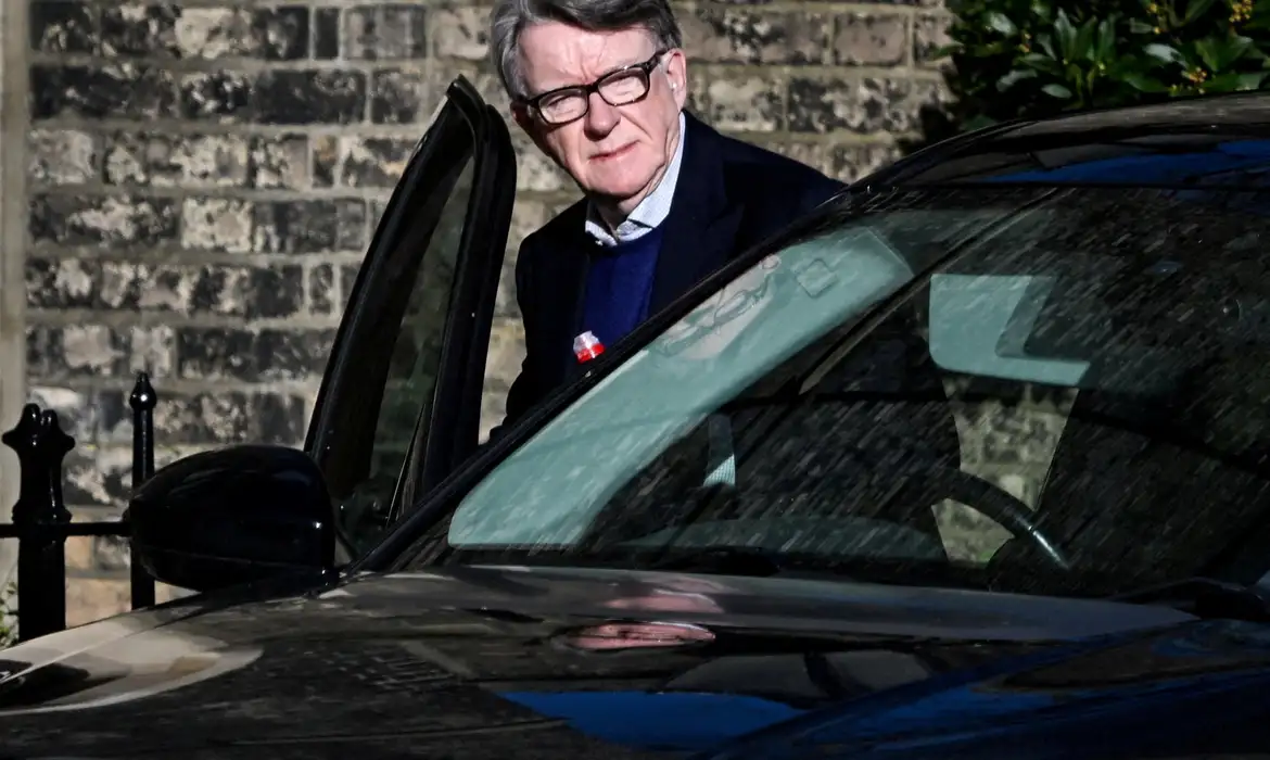 FILE PHOTO: Former British Ambassador to the U.S. Peter Mandelson enters a vehicle outside a reported residence, after police launched a misconduct in public office investigation following the release of U.S. Justice Department files linked to the late financier and convicted sex offender Jeffrey Epstein, in London, Britain, February 14, 2026. REUTERS/Chris Ratcliffe