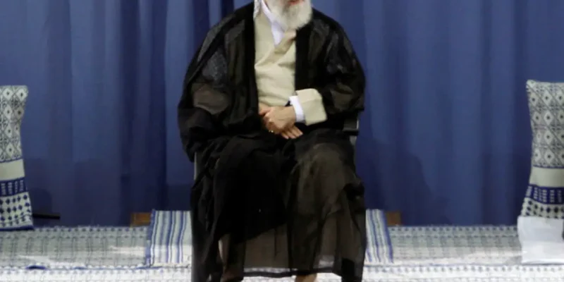 FILE PHOTO: Iranian President Mahmoud Ahmadinejad (R) and Parliament Speaker Ali Larijani (L) listen to a speech by Supreme Leader Ayatollah Ali Khamenei during a ceremony for Ahmadinejad's confirmation as Iran's President in Tehran  August 3, 2009. Iran's supreme leader formally approved the second term presidency of Ahmadinejad on Monday after a disputed election that leading reformists say was rigged to ensure the incumbent's victory.  REUTERS/khamenei.ir  QUALITY FROM SOURCE/File Photo