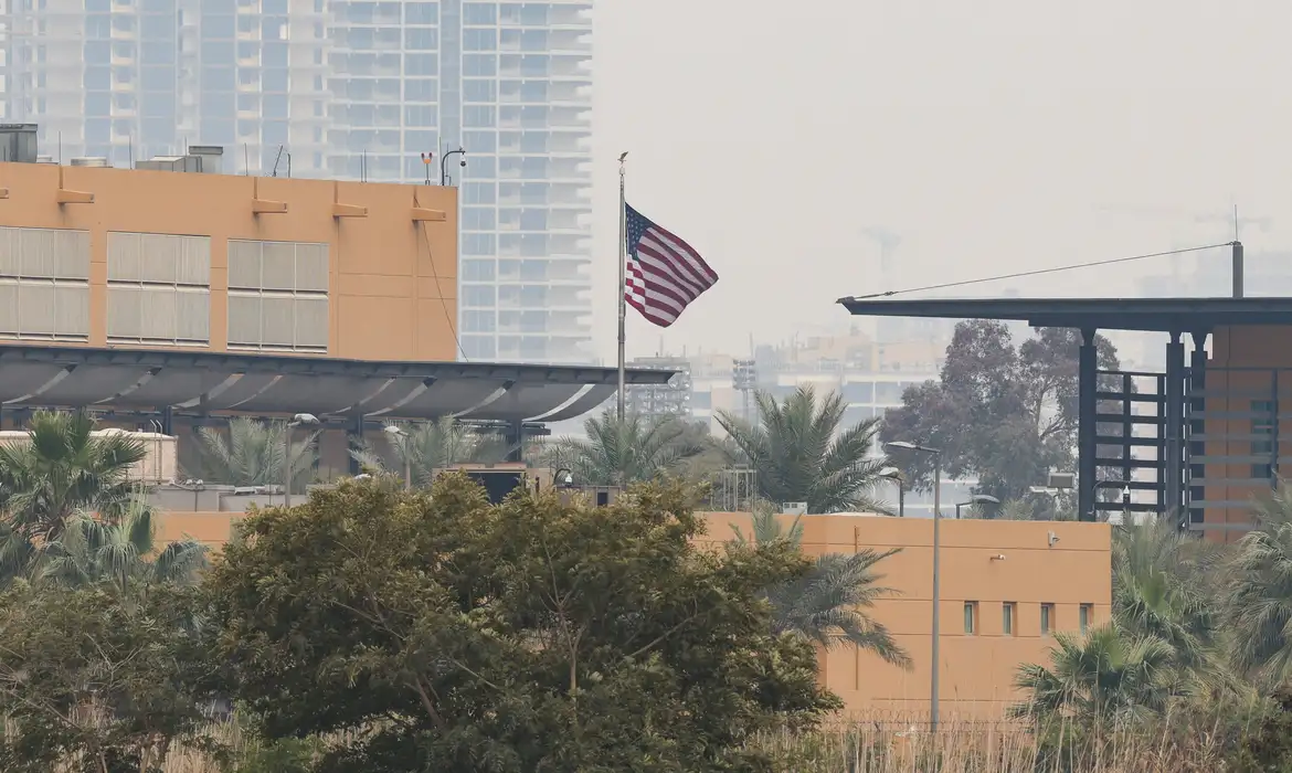 The U.S. flag flies at the U.S. Embassy, after Iraqi security sources said the embassy was hit in a missile attack, in Baghdad, Iraq, March 14, 2026. REUTERS/Ahmed Saad