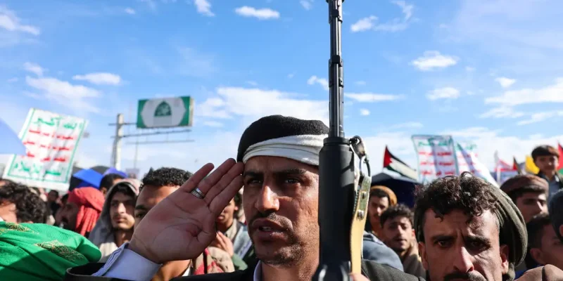 Protester salutes during national anthem, as Houthi supporters demonstrate in solidarity with Iran, as the U.S.-Israeli conflict with Iran continues, in Sanaa, Yemen, March 27, 2026. REUTERS/Khaled Abdullah