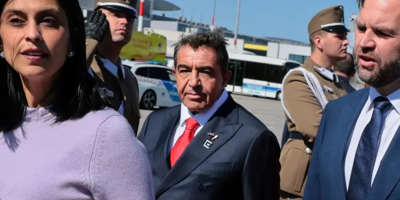 Paolo Zampolli (2nd L), a friend of President Donald Trump and Trump's envoy for global partnerships, joins Hungarian Foreign Minister Peter Szijjarto and other dignitaries on the red carpet to welcome U.S. Vice President JD Vance and second lady Usha Vance as they arrive at Budapest Ferenc Liszt International Airport in Budapest, Hungary, April 7, 2026. REUTERS/Jonathan Ernst/Pool