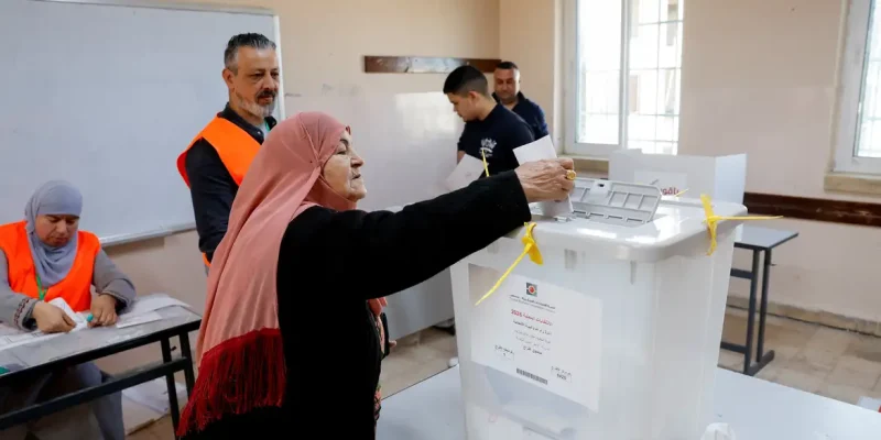 A Palestinian woman votes during the municipal council election, in Birzeit near Ramallah, in the Israeli-occupied West Bank, April 25, 2026. REUTERS/Mohammed Torokman