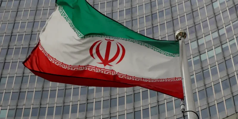 FILE PHOTO: An Iranian flag flutters in front of the International Atomic Energy Agency (IAEA) headquarters in Vienna, Austria September 9, 2019.   REUTERS/Leonhard Foeger/File Photo