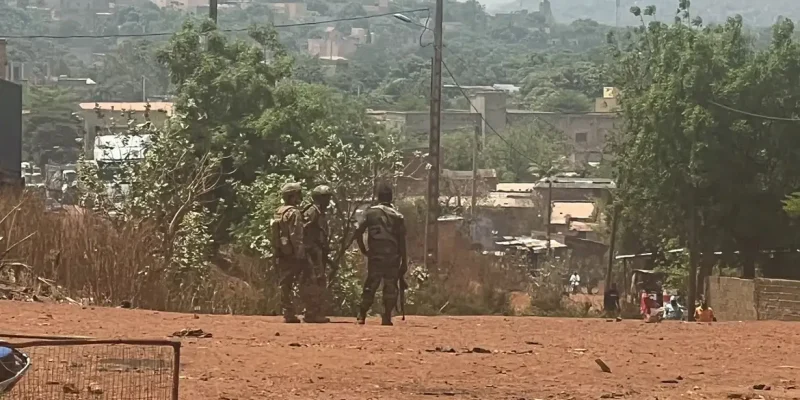 FILE PHOTO: Malian soldiers stand during a patrol following the attack on Mali's main military base Kati, outside the capital Bamako, in Kati, Mali, April 26, 2026. REUTERS/Stringer/File Photo