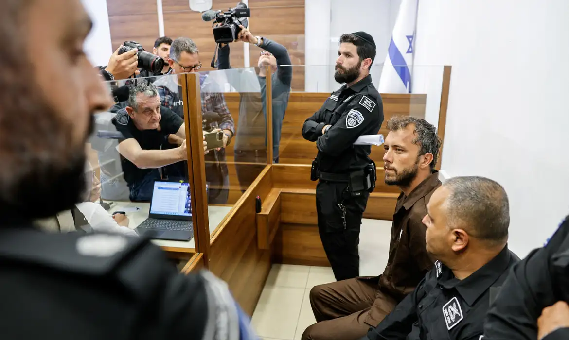 Activist Thiago Avila, a member of the Global Sumud Flotilla detained by Israel, sits at a magistrate's court to attend a detention extension hearing in Ashkelon, southern Israel, May 3, 2026. REUTERS/Amir Cohen