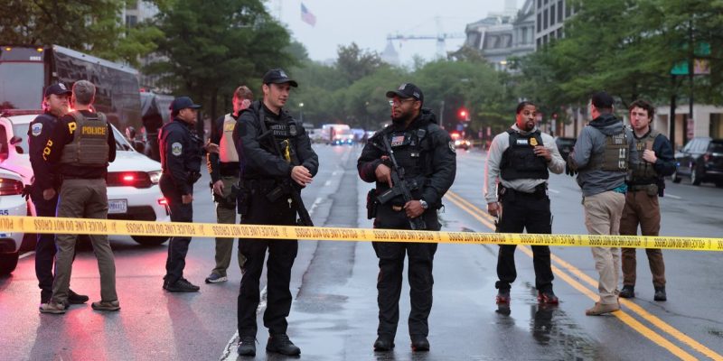 Law enforcement agents stand behind yellow tape near the White House, after gunshots were heard nearby, in Washington, D.C., U.S., May 23, 2026. REUTERS/Kylie Cooper