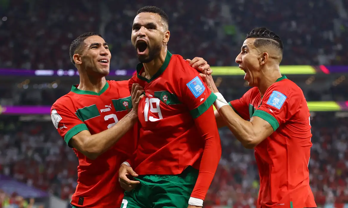 Soccer Football - FIFA World Cup Qatar 2022 - Quarter Final - Morocco v Portugal - Al Thumama Stadium, Doha, Qatar - December 10, 2022 Morocco's Youssef En-Nesyri celebrates scoring their first goal with teammates REUTERS/Carl Recine