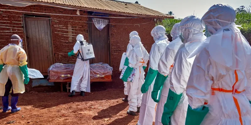 Red Cross workers wearing personal protective equipment (PPE) disinfect the house of an unidentified man who died of Ebola before retrieving his body, as aid agencies intensify efforts to contain a new Ebola outbreak involving the Bundibugyo strain, in Quartier Shuni 1, a residential sector in Mongbwalu, Djugu Territory of Ituri province, Democratic Republic of Congo, May 24, 2026. REUTERS/Gradel Muyisa Mumbere     TPX IMAGES OF THE DAY