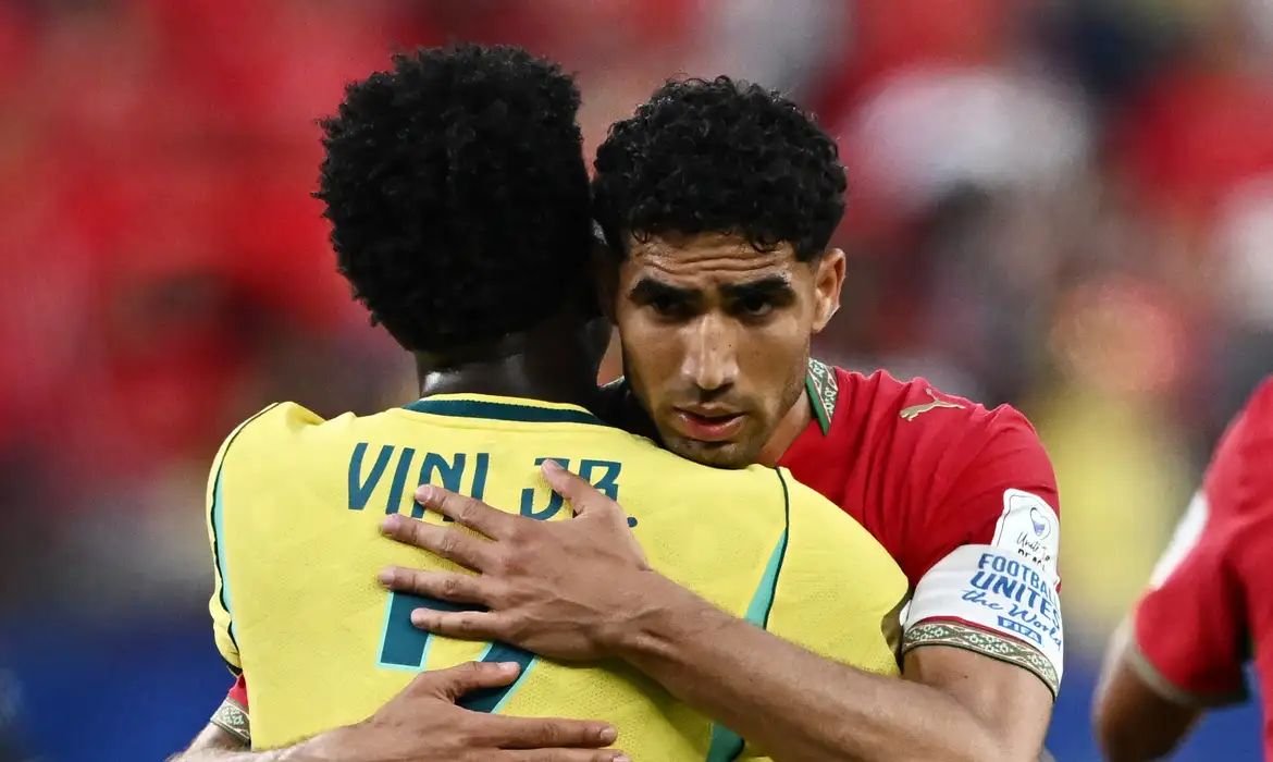 Soccer Football - FIFA World Cup 2026 - Group C - Brazil v Morocco - New York/New Jersey Stadium, East Rutherford, New Jersey, U.S. - June 13, 2026 Morocco's Achraf Hakimi embraces Brazil's Vinicius Junior after the match REUTERS/Dylan Martinez