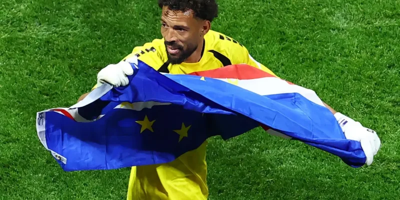 Soccer Football - FIFA World Cup 2026 - Group H - Spain v Cape Verde - Atlanta Stadium, Atlanta, Georgia, U.S. - June 15, 2026 Cape Verde's Vozinha celebrates with their national flag after the match REUTERS/Bernadett Szabo