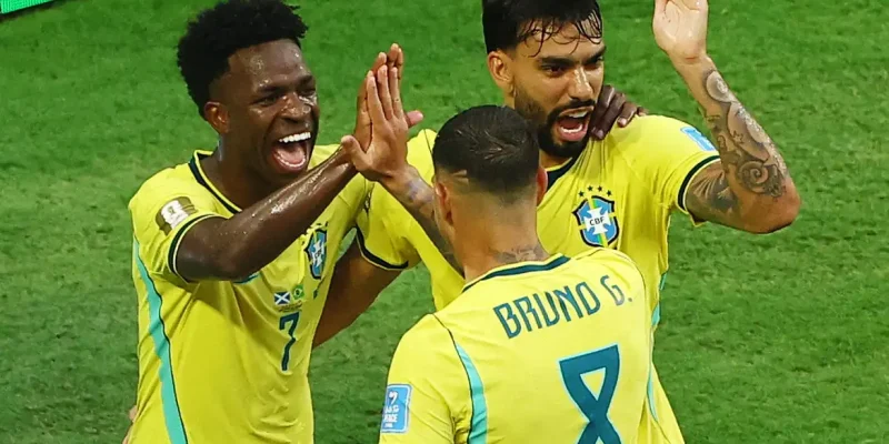 Soccer Football - FIFA World Cup 2026 - Group C - Scotland v Brazil - Miami Stadium, Miami Gardens, Florida, U.S. - June 24, 2026 Brazil's Vinicius Junior celebrates scoring their second goal with Lucas Paqueta and Bruno Guimaraes REUTERS/Marco Bello