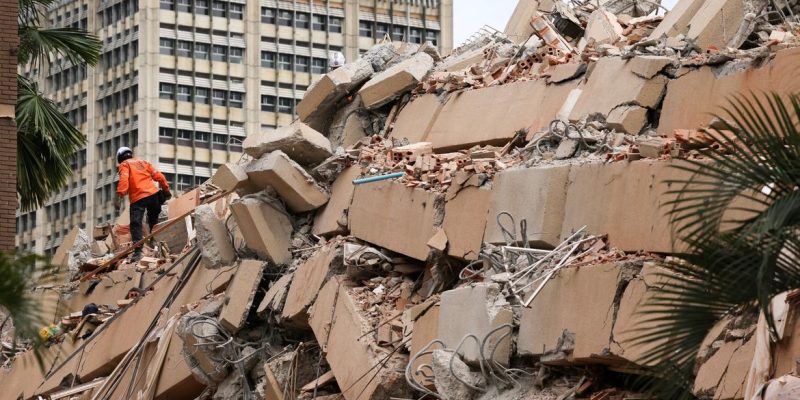 A rescuer works at the site of a collapsed building after earthquakes hit the country, in Caracas, Venezuela, June 25, 2026. REUTERS/Leonardo Fernandez Viloria