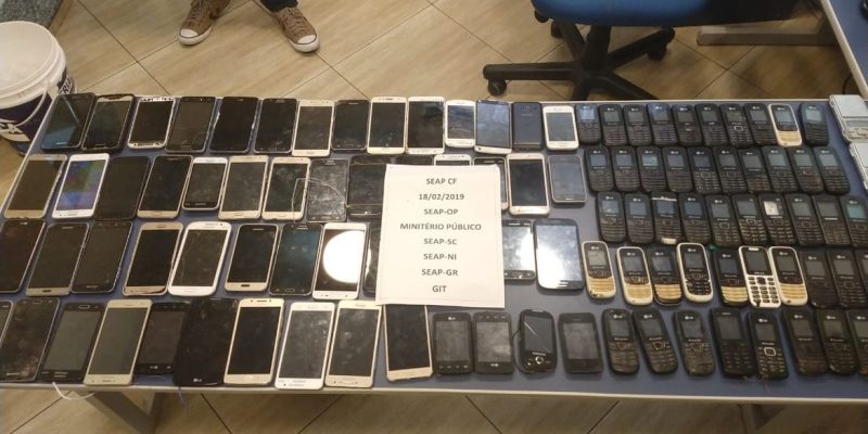 Divulgação da Secretaria Estadual de Administração Penitenciária sobre apreensão de mais de 100 celulares em presídio de Campos.