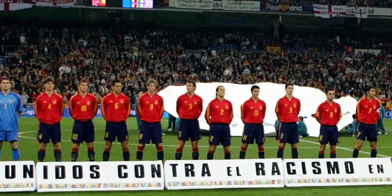 Spanish football players line up in front of anti-racism banner prior to their international friendly against England in Madrid.  Spain's football team line-up in front of a banner which reads