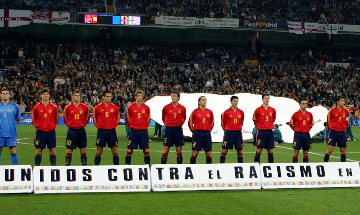 Spanish football players line up in front of anti-racism banner prior to their international friendly against England in Madrid.  Spain's football team line-up in front of a banner which reads