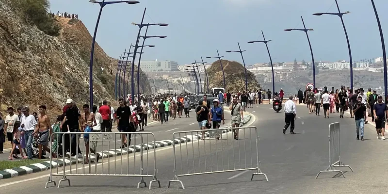 Migrants cross on foot into the North African enclave of Ceuta from Morocco by attemping to swim, according to Spain's Guardia Civil, near the border with Ceuta, in Fnideq, Morocco, July 30, 2026, in this still image obtained by REUTERS. THIS IMAGE HAS BEEN SUPPLIED BY A THIRD PARTY.   VERIFICATION: - Buildings, coastline and road layout matched satellite and archive imagery. - Coordinates: 35.85783579352456, -5.346942135788912. - Date verified by original file metadata.