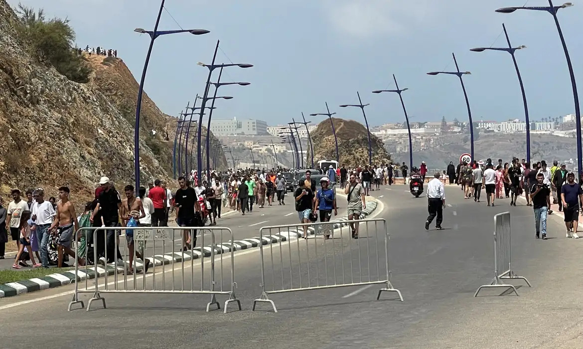 Migrants cross on foot into the North African enclave of Ceuta from Morocco by attemping to swim, according to Spain's Guardia Civil, near the border with Ceuta, in Fnideq, Morocco, July 30, 2026, in this still image obtained by REUTERS. THIS IMAGE HAS BEEN SUPPLIED BY A THIRD PARTY.   VERIFICATION: - Buildings, coastline and road layout matched satellite and archive imagery. - Coordinates: 35.85783579352456, -5.346942135788912. - Date verified by original file metadata.
